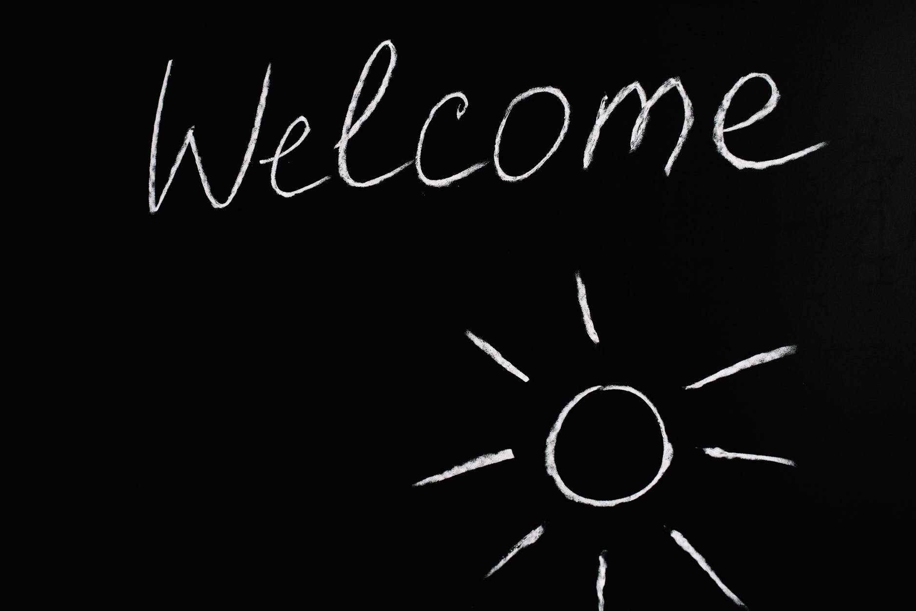 welcome lettering text on black background