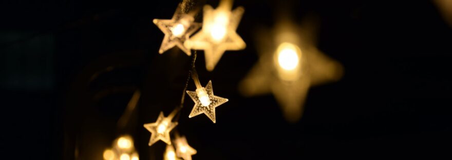 shallow focus photography of yellow star lanterns